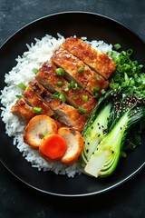 Deliciously Grilled Chicken Served on a Bed of Steamed Rice Accompanied by Fresh Vegetables and Garnished with Green Onions on a Black Plate