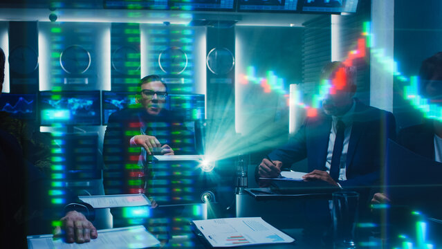 Corporate Meeting With Diverse Team Analyzing Financial Data Showing by Holographic Projector. Business Professionals Discussing Numbers and Charts in Conference Room. Investors Work on Growth - Powered by Adobe