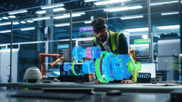 Male Engineer Uses an Augmented Reality Headset to Interact With 3D Holographic Model of Engine in a High Tech Factory, Showcasing Innovative Manufacturing Processes and Advanced Digital Visualization - Powered by Adobe