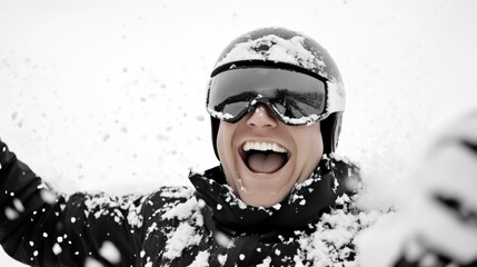 Snow-covered skier with beaming smile in the mountains