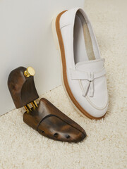 wooden shoe spacers to preserve the shape of women's shoes. Photography in the home interior