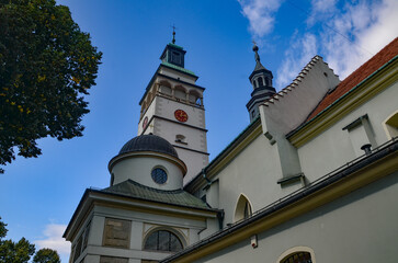 Cathedral of the Nativity of the Blessed Virgin Mary in Żywiec – a temple built in the fifteenth century with a high tower with a clock on it © Pawel Filusz
