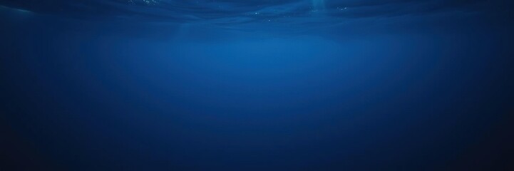 Obraz premium Dark blue ocean surface seen from underwater, marine life, waves