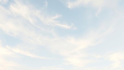 Fototapeta premium Soft wispy clouds drift lazily across a pale blue sky with touches of creamy white and pale gold, evoking a sense of serenity and peacefulness, soft focus, pastel colors, dreamy scenery