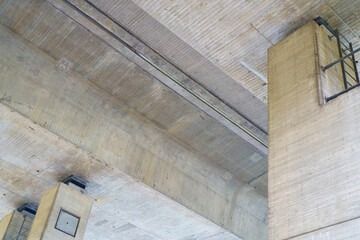 Close-up of concrete structure of highway bridge. Concept of giant structures