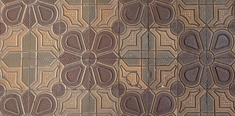 Colorful sidewalk tiles with geometric shapes in an urban environment. View of colorful sidewalk tiles with geometric design. Background of beautiful street tiles close-up