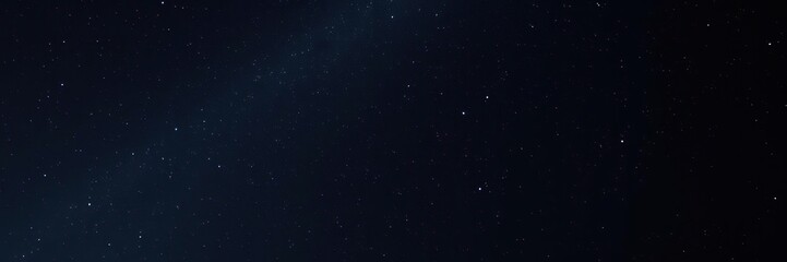 Dark canvas of midnight sky with countless twinkling stars suspended above the earth, universe, nebulae, constellations