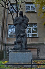 Naklejka premium Exterior view of a fragment of an ancient infectious disease hospital with a sculpture of a mother with many children, Sofia, Bulgaria 