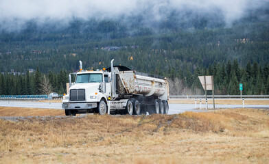 Heavy Cargo on the Road. A truck hauling freight along a highway. Taken in Alberta, Canada