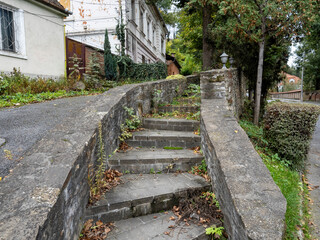 old stone stairs, a stone staircase with a sign that says  the word  on it. Sighișoara, Romania
