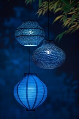 Obraz premium Elegant Blue Hanging Lanterns Illuminating Night Sky - Beautiful Decorative Lighting for Home Decor, Events, and Outdoor Spaces