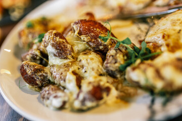 Tasty meat in creamy sauce with mashed potatoes and vegetables. Food and drink concept.