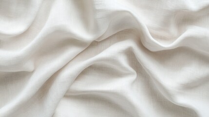 Delicate white fabric drapes elegantly, showcasing smooth texture and soft, flowing folds.