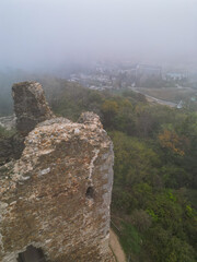 medieval fantasy tower with modern hotels in the background - aerial drone photo, serbia, vrdnik, fruska mountain