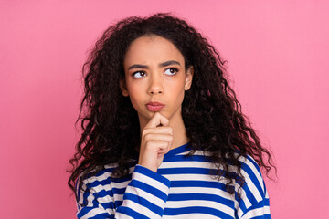 Photo of pretty young girl lok empty space wear striped pullover isolated on pink color background