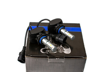 Light bulbs for car lamps. Automotive part in Silvery metallic and black color with wires and connecting elements