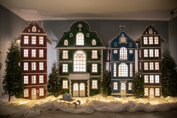 Naklejka premium old town in winter christmas tree in a room fireplace christmas tree with christmas decorations celebration home New Year holiday