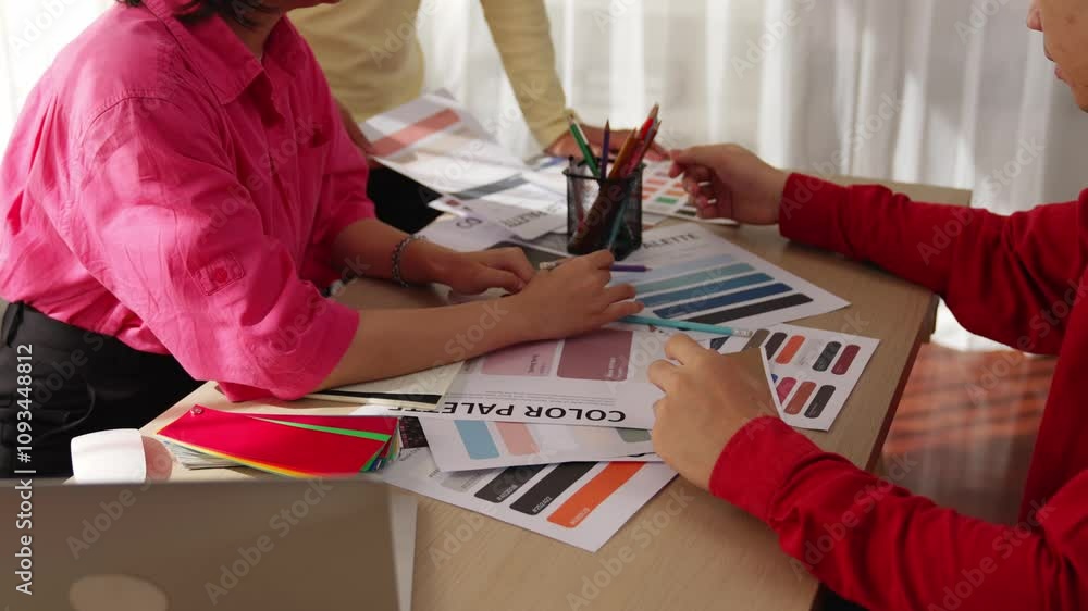 Poster slow motion hand closeup of designer team brainstorming and choosing color for graphic design workin