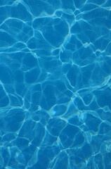 background of azure pool water with light reflections without other people or objects