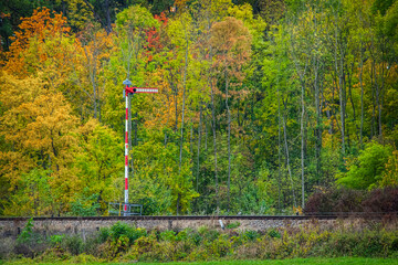 Czech railway mechanical signal on the background of the autumn forest