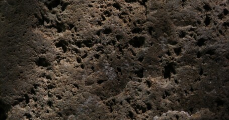 Textured Stone Surface with Light and Shadow Play