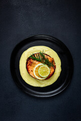 salmon steak, fried, mashed potatoes, top view, rosemary, lemon and lime, homemade, one serving, no people,