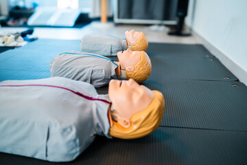 CPR Training Mannequins on the Floor Ready for Life-Saving Classes Simulating Emergency Response Education for Medical Personelle