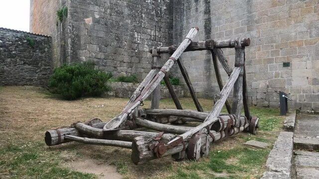 Old catapult in disuse at the entrance of a medieval fortress in Castro Caldelas, Galicia-Spain.
