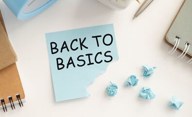 On the paper for writing text Back to Basics, notebook, pen, reports