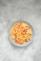 shrimp in creamy garlic sauce, with spices and herbs,