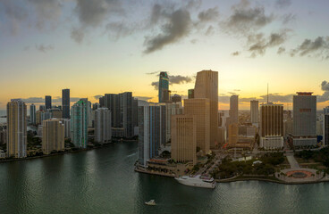 Fototapeta premium Aerial view of downtown district of of Miami Brickell in Florida, USA at sunset. High commercial and residential skyscraper buildings in modern american megapolis