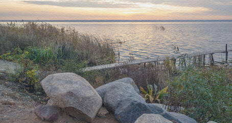Rocky shoreline with a body of water in the background