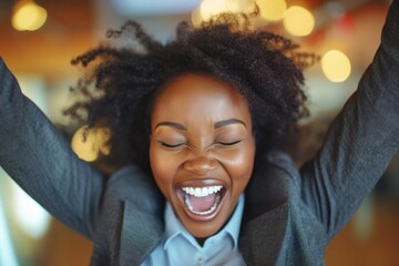 A woman raises her arms in triumph, conveying a sense of liberation and joy