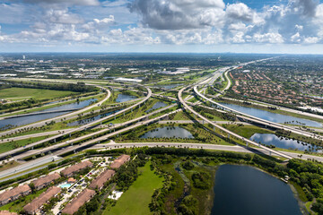 Complex highway overpass elevated direction lanes with busy traffic in Miami, Florida. American...