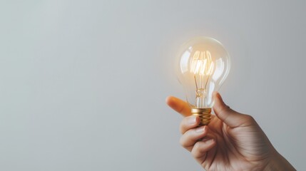 hand holding light bulb on white background copy space great idea creativity start bright electricity invention