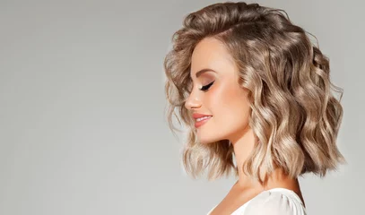 Beautiful  blonde model  girl  with short  curly  hair . Smiling  woman hairstyle wavy curls .     Fashion , beauty and makeup portrait © Sofia Zhuravetc