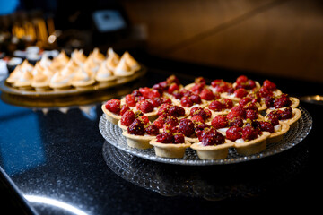 Delicious assortment of baked sweets including muffins, tarts, and cupcakes perfect for any festive celebration