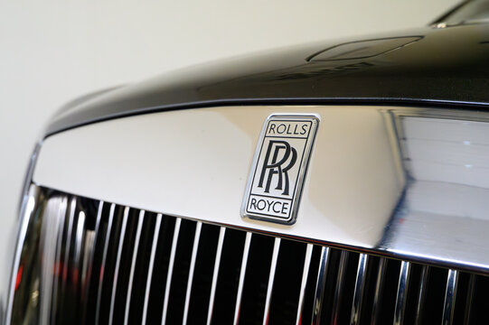 Derby, UK - 17 Nov 2024: Rolls Royce Iconic RR Badge on a black wraith