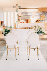 Church gold chair decorations, wedding mass, church wedding, faith, religious ceremony, Catholic religion, wedding decorations,