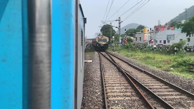 indian railway crossing tracks at a time