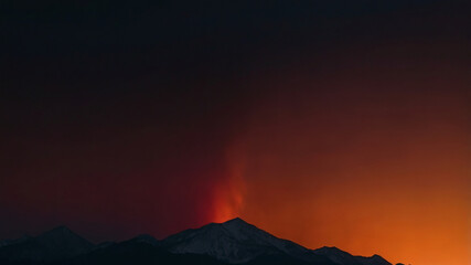 Volcanic Glow with Smoke Rising into the Twilight Sky