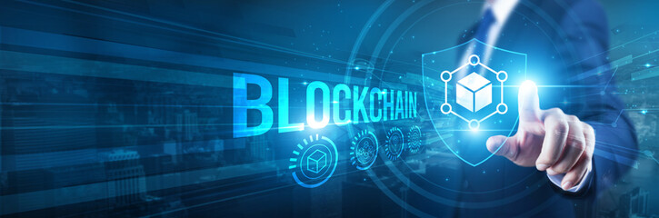 Businessman hand touches a shield, blockchain security protocol technology. The concept represents...