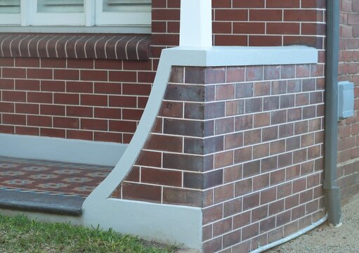 Architectural brickwork detail on the veranda of a tuck pointed house