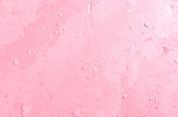 Fototapeta premium Pink textured wall.