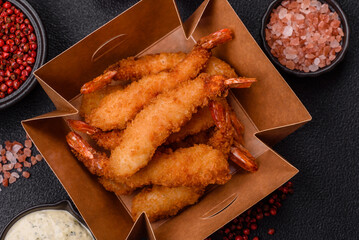 Hot crispy shrimp breaded with salt and spices with white sauce