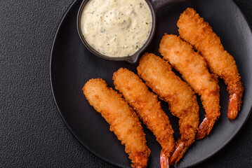 Hot crispy shrimp breaded with salt and spices with white sauce