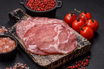Antipasto jamon, prosciutto, sausage, sliced with tomatoes, salt and spices