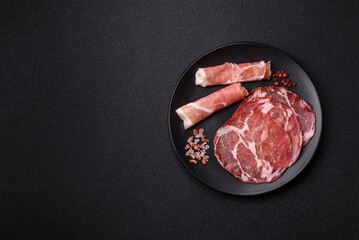 Antipasto jamon, prosciutto, sausage, sliced with tomatoes, salt and spices