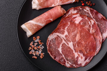 Antipasto jamon, prosciutto, sausage, sliced with tomatoes, salt and spices