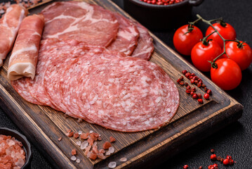 Antipasto jamon, prosciutto, sausage, sliced with tomatoes, salt and spices